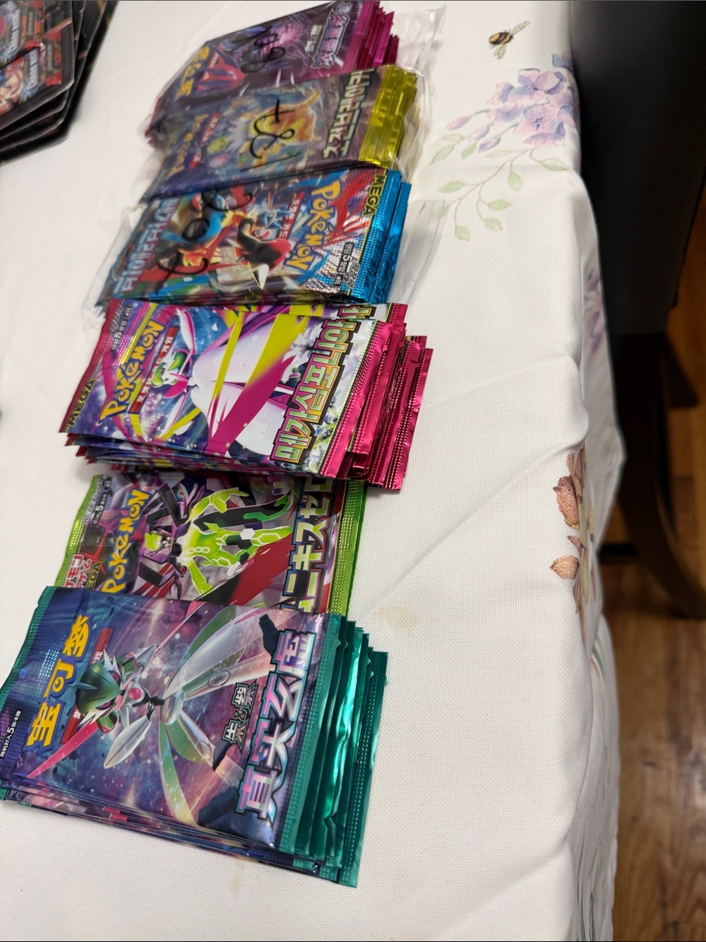 Pokemon booster packs - teal, pink, blue, purple, green winner is choice